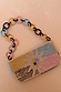Soleil Bag featuring a hand-embellished beaded sun print in pastels with a chunky multi-coloured chain strap.