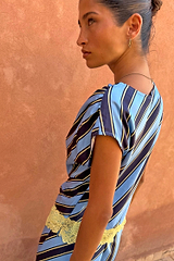 Stripe A-Symmetrical Top in blue and navy with yellow lace trim, shown in a side profile view.