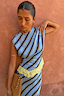 Thumbnail for Stripe A-Symmetrical Top featuring blue diagonal stripes and yellow lace trim, styled on a model.