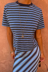 Stripe Bra Baby T-Shirt in blue and navy horizontal stripes with a crew neck, styled with the matching striped skirt.