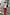 Thumbnail for White Rodeo T-Shirt with red lettering and a relaxed fit, styled with a pink patterned skirt and a beaded bag.