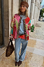 Thumbnail for Pink Dallas Reversible Quilted Jacket with cowgirl motifs and leopard trim, styled with baggy jeans for a street look.