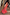 Thumbnail for Red Bandana Remi Dress featuring leopard print frill sleeves and an asymmetrical hem on a sunlit wooden deck.