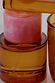 NFD Eau De Parfum 002 in an amber glass bottle with a marbled pink cap and gold script branding.