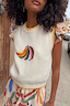 Thumbnail for Cream Banana Tank featuring a colourful embroidered banana motif and yellow contrast stitching at the neckline and hem.