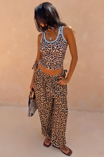 Leopard Balloon Trouser with an elasticated tie waist and side pockets in an all-over animal print.
