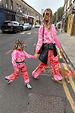 Kids Red and Pink Bandana Knitted Set on a child walking with a model and a dog on a London street.