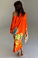 Thumbnail for Orange Rio Jem Dress with a bright tropical sun and fruit print, featuring a relaxed, off-the-shoulder fit.