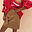 Iconic Tan Suede Mini Jaspre Skirt with a wrap tie waist, styled with a red graphic cardigan.