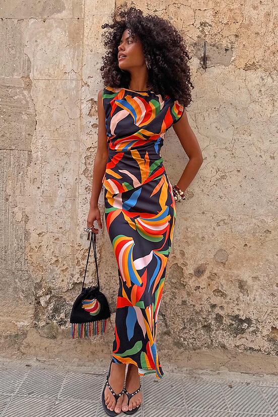Banana Dorris Skirt with a hand-painted multicoloured print on black jersey, designed in London and styled as a co-ord.