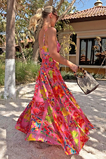 Pink Fruit Stamps Skirt with a Mediterranean fruit print and shirred waistband, worn on a sandy beach vacation.
