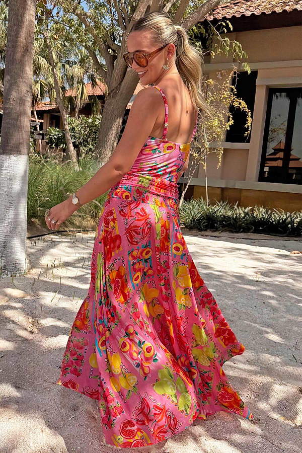 Pink Fruit Stamps Skirt with a Mediterranean fruit print and shirred waistband, styled with a matching top on vacation.