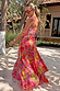 Pink Fruit Stamps Skirt with a Mediterranean fruit print and shirred waistband, styled with a matching top on vacation.