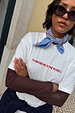 Blue Cotton Stripe Bandana tied around the neck, styled with a white graphic t-shirt and studded sunglasses.