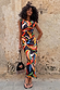 Banana Dorris Skirt with a hand-painted multicoloured banana print on black jersey, worn as a matching co-ord.