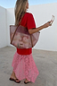 Thumbnail for Red and Pink Cara T-Shirt Midaxi Dress with a cotton top and delicate lace skirt, styled with a tote bag for a vacation.