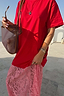 Red and Pink Cara T-Shirt Dress featuring a cotton top and contrasting pink floral lace skirt detail.