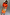 Thumbnail for Orange Rio Jem Dress with a tropical fruit print and long sleeves in a relaxed, modest silhouette, designed in London.