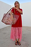 Red and Pink Cara T-Shirt Dress with a jersey top and attached pink lace skirt, styled with a sheer tote.
