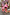 Thumbnail for Kids Red and Pink Bandana Knitted Set styled on a young girl with a coordinated adult outfit on a London street.