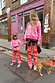 Kids Red and Pink Bandana Knitted Set styled on a young girl with a coordinated adult outfit on a London street.