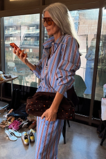 Blue Cotton Stripe Miley Shirt with red pinstripes, styled with a brown studded clutch for a London look.