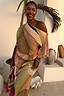 Green Abstract Tilly Dress with metallic gold flecks and a pleated one-shoulder design in a vacation setting.
