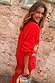 Red Celestial Cardigan in a soft knit with embroidered sun and palm motifs, paired with a matching skirt.