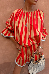 Tomato Stripe Blouse in red and camel stripes with voluminous sleeves and gathered neckline, styled as a vacation co-ord.