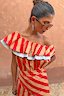 Tomato Stripe Mini Dress in red and camel with a tiered ruffle neckline and blue contrast trim.