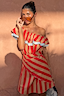 Thumbnail for Multi-wear Tomato Stripe Scarf in red and tan, styled as a ruffled off-the-shoulder dress on a model.