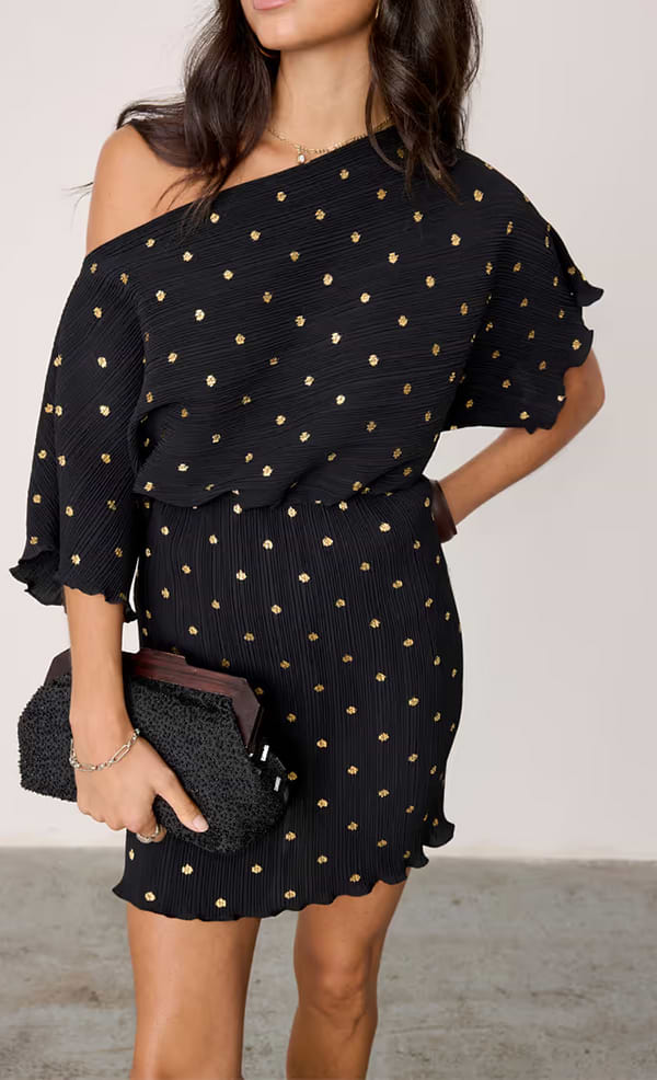 model wears our black plisse tilly mini dress with gold fleck 