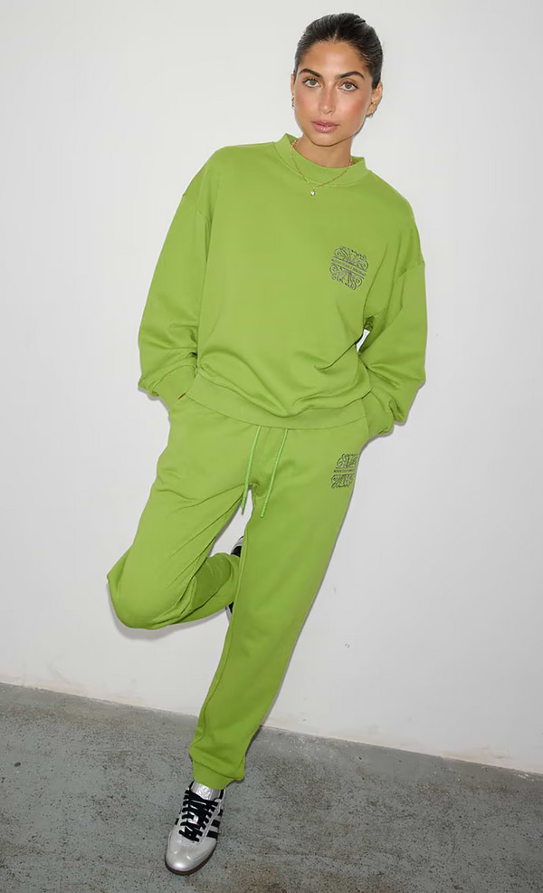 model is wearing the olive and charcoal tracksuit 
