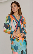 model is wearing the balearic multicoloured cardigan with the matching dorris skirt