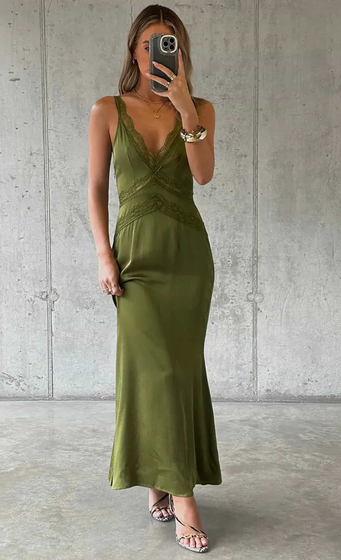 model is wearing the olive satin midi dress with lace inserts on the waist and neckline