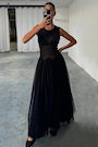 model is taking selfie wearing the black monika dress