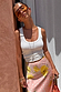 White Scoop Neck Rib Tank in a soft stretch fabric, a capsule wardrobe staple styled for a chic London look.