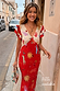 Red Celestial Midi Dress with sun motifs, a V-neck blouson top and ruffled sleeves, with petite sizing available.