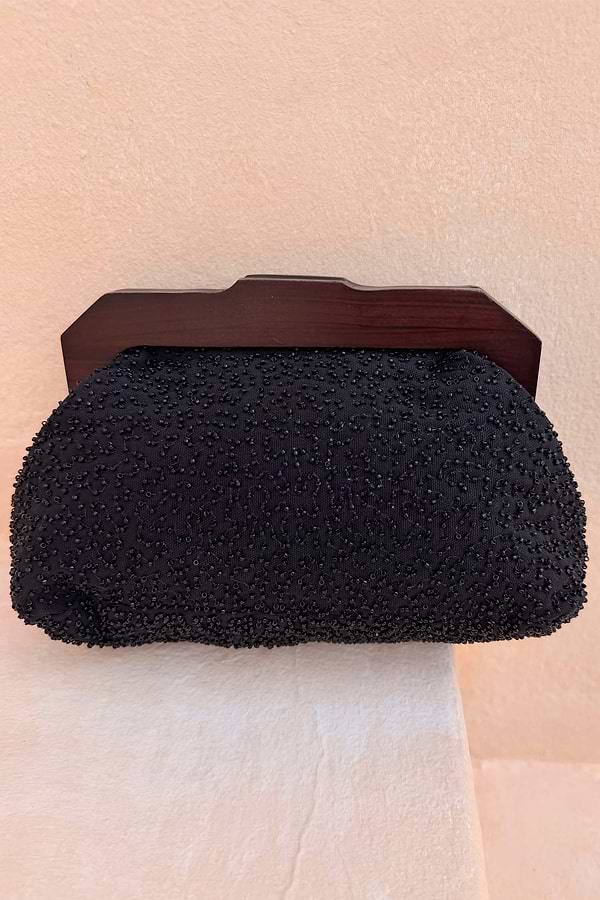 Black Beaded Mirror Bag featuring intricate glass beadwork and a dark brown wooden handle.