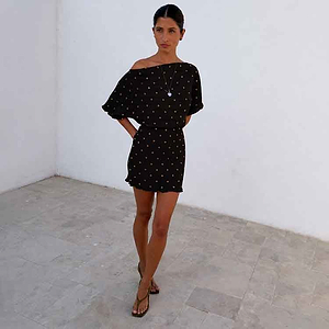 Black Plisse Mini Tilly Dress with gold metallic dots and an off-the-shoulder neckline, perfect for vacation.