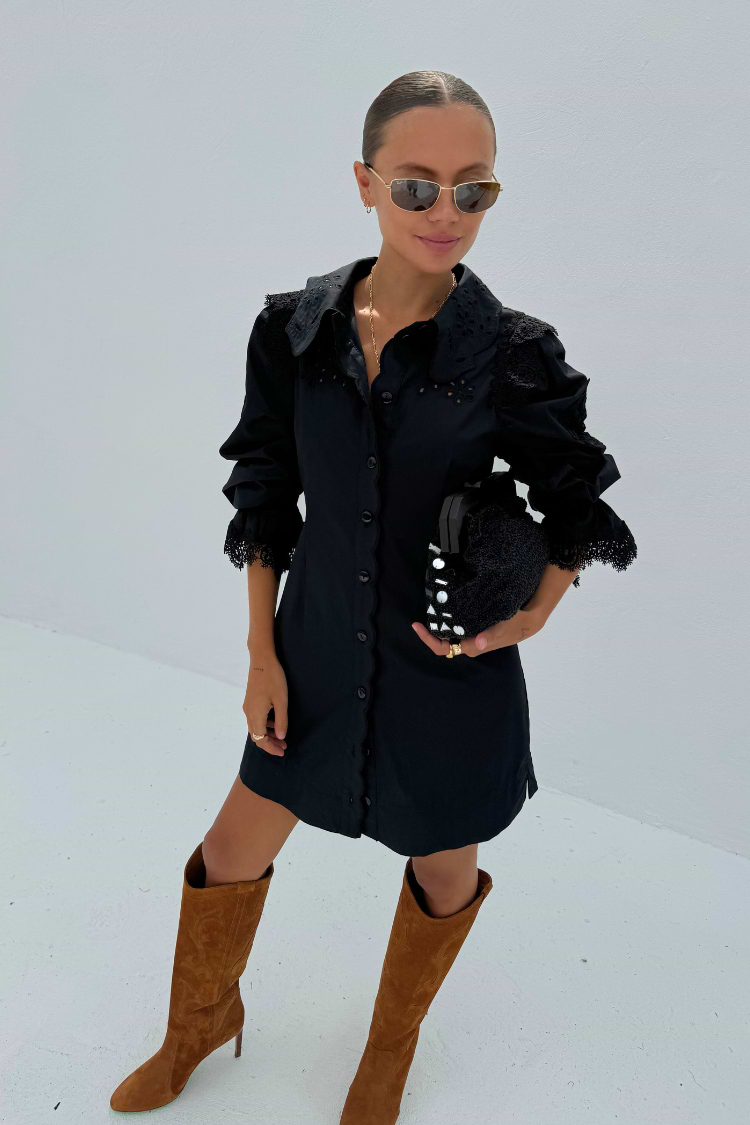 model is wearing our black sicily shirt dress with knee high suede brown boots