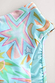 Blue Dreamer High Waist Brief detail showing the blue abstract print with iconic sun, star and palm motifs.