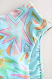 Blue Dreamer High Waist Brief detail showing the blue abstract print with iconic sun, star and palm motifs.