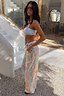 Thumbnail for Blue Dreamer Trouser featuring a pastel sun and star print and tassel waist, styled for a vacation beach look.