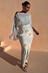 Blue Soleil Anais Dress with sun motifs, off-the-shoulder top and a bias cut maxi skirt on a curve model.