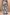 Thumbnail for Soleil Jeans in blue denim with oversized sun motifs and wavy lines, shown from the back as a matching co-ord.