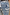 Thumbnail for Soleil Jeans back pocket detail featuring a blue and white wavy line print and embroidered sun motif.