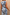 Thumbnail for Soleil Denim Waistcoat featuring white sun motifs and blue wavy lines, shown from the back in a denim co-ord.