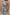 Thumbnail for Soleil Denim Waistcoat with blue sun motifs and button fastening, styled as a sleeveless denim co-ord.