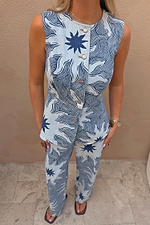 Sleeveless Soleil Denim Waistcoat featuring a blue sun motif print and button front, styled as a co-ord.